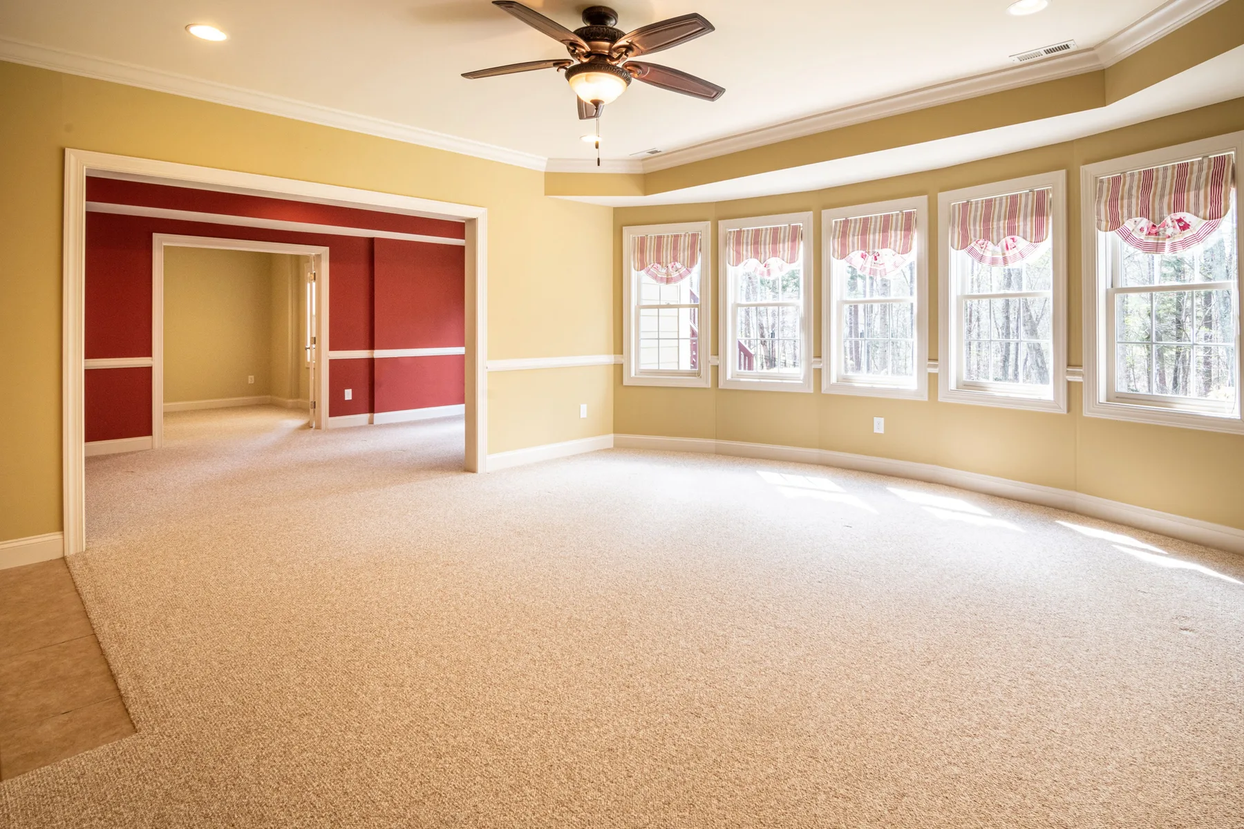 Handyman installing a ceiling fan in a Port St Lucie home