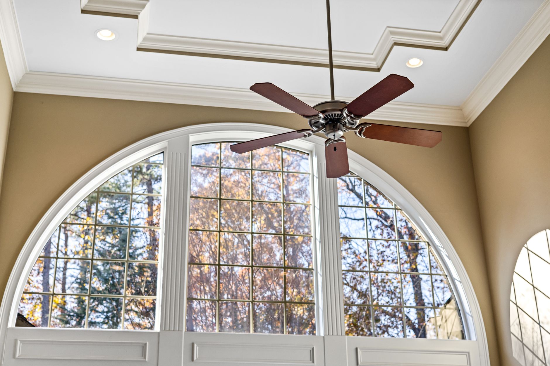 Finished ceiling fan installation with light kit in a South Florida living room